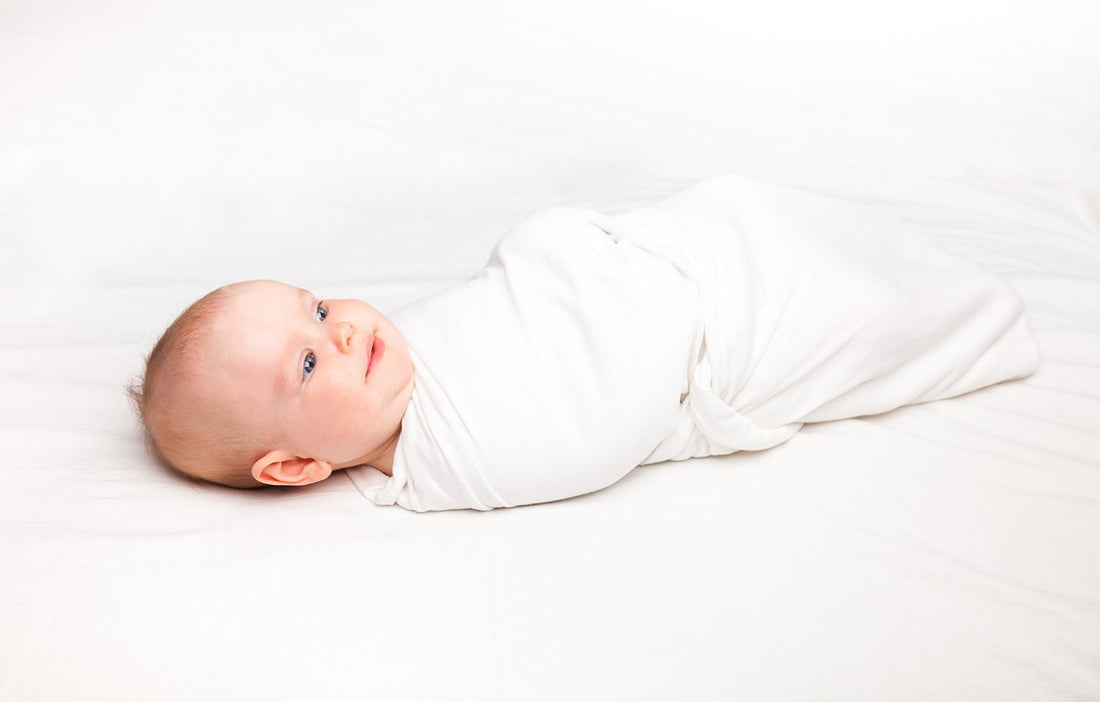 Safely Swaddled Baby In Crib